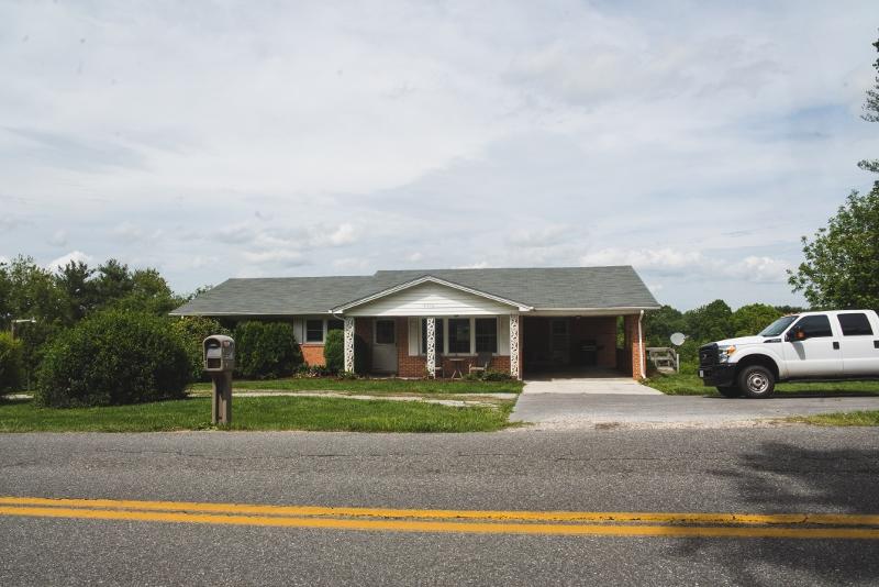 5072 Old Pike Road Pilot, VA 24138 - Photo 4 of 55 a front view of a house with garden