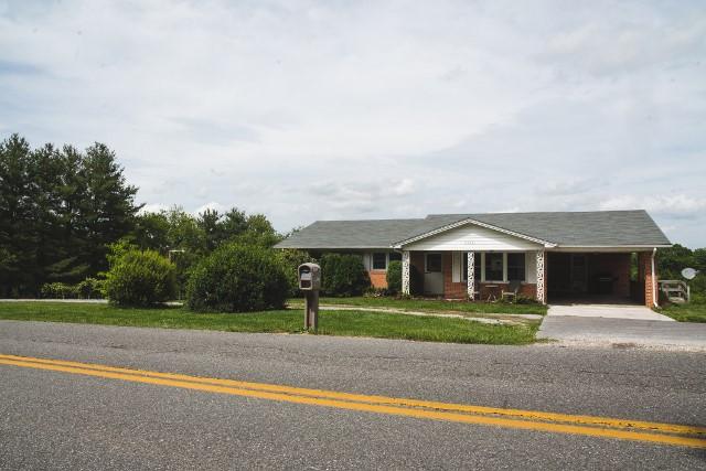 5072 Old Pike Road Pilot, VA 24138 - Photo 5 of 55 a front view of house with yard and green space