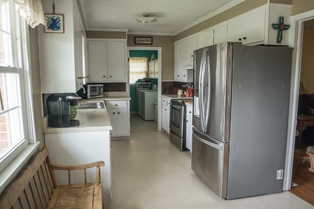 5072 Old Pike Road Pilot, VA 24138 - Photo 8 of 55 a kitchen with a refrigerator and a stove top oven