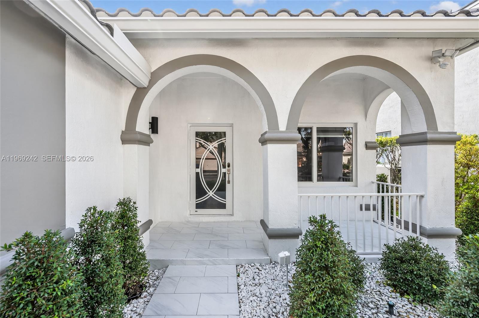 4115 Sabal Ridge Circle Weston, FL 33331 - Photo 42 of 42 a front view of a house with garden