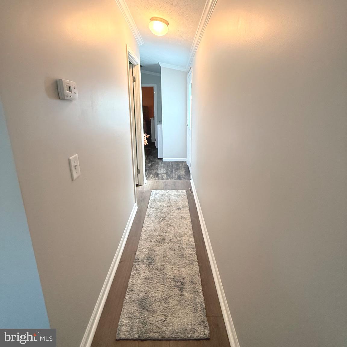 182 5th Avenue Media, PA 19063 - Photo 14 of 26 a view of a hallway with wooden floor and staircase