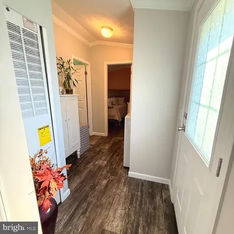 a living room with a couch and wooden floor