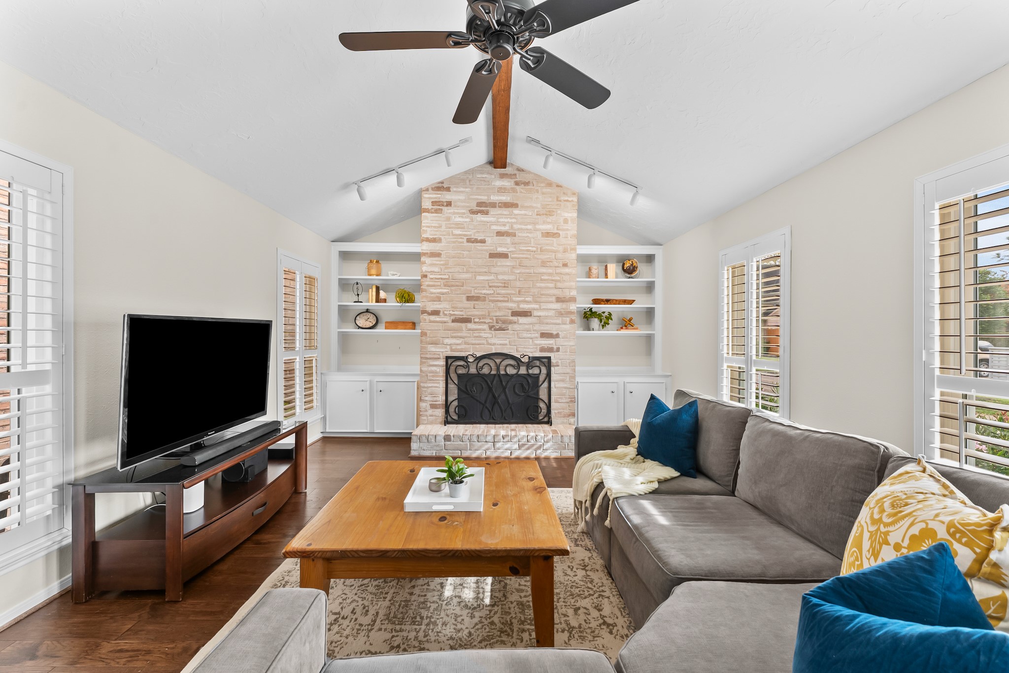 1546 Beaconshire Houston, TX 77077 - Photo 5 of 29 a living room with furniture and a flat screen tv