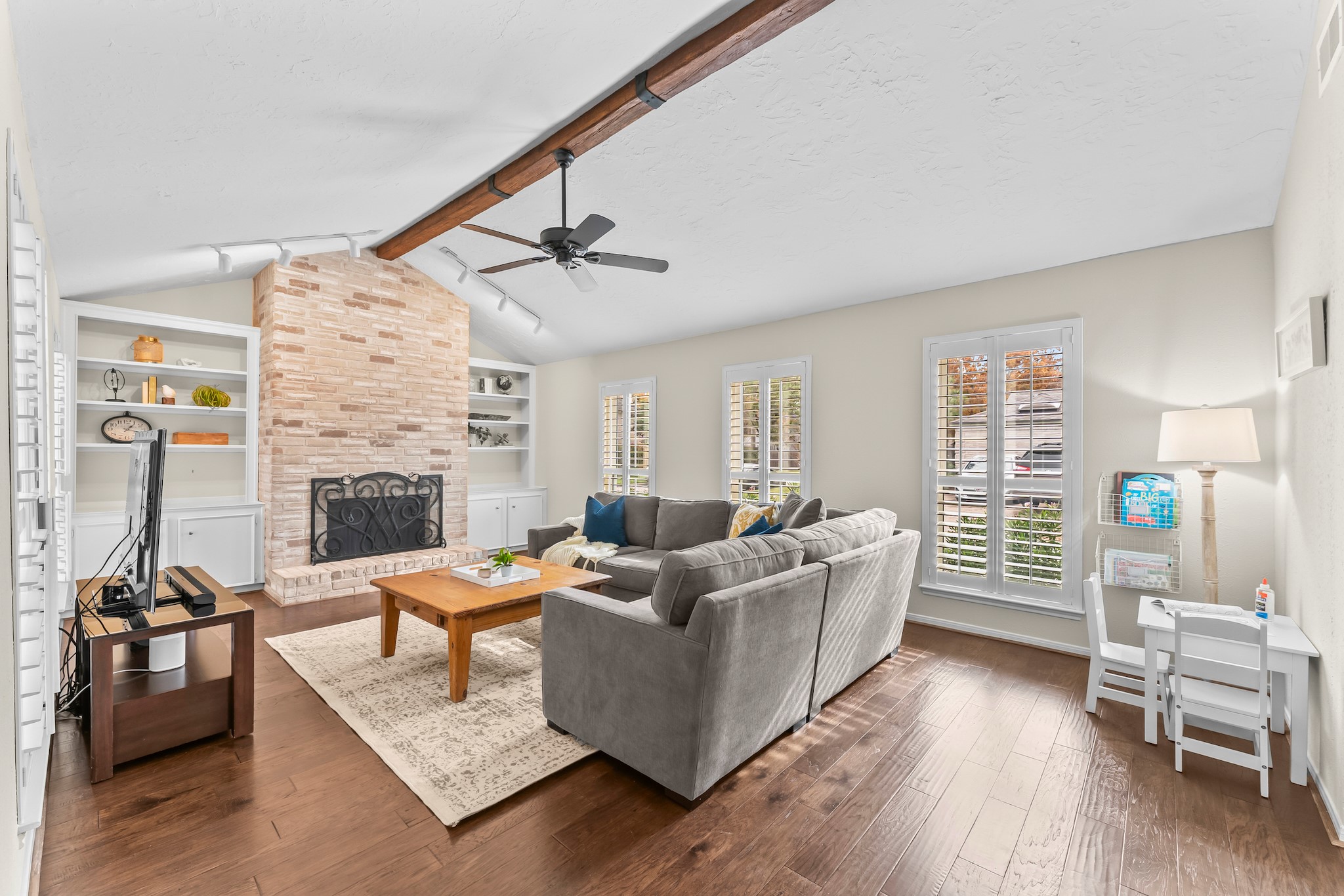 1546 Beaconshire Houston, TX 77077 - Photo 6 of 29 a living room with furniture and a fireplace