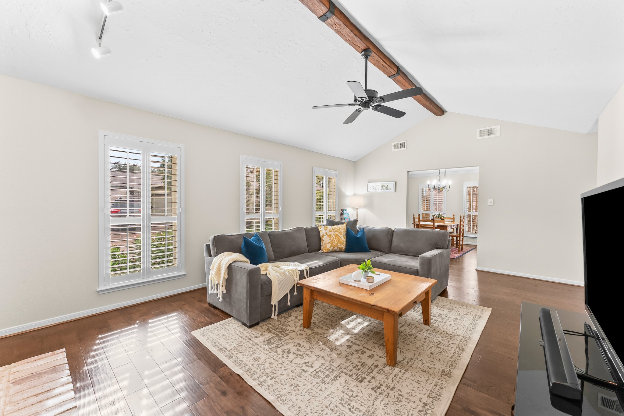1546 Beaconshire Houston, TX 77077 - Photo 7 of 29 a living room with furniture and a flat screen tv