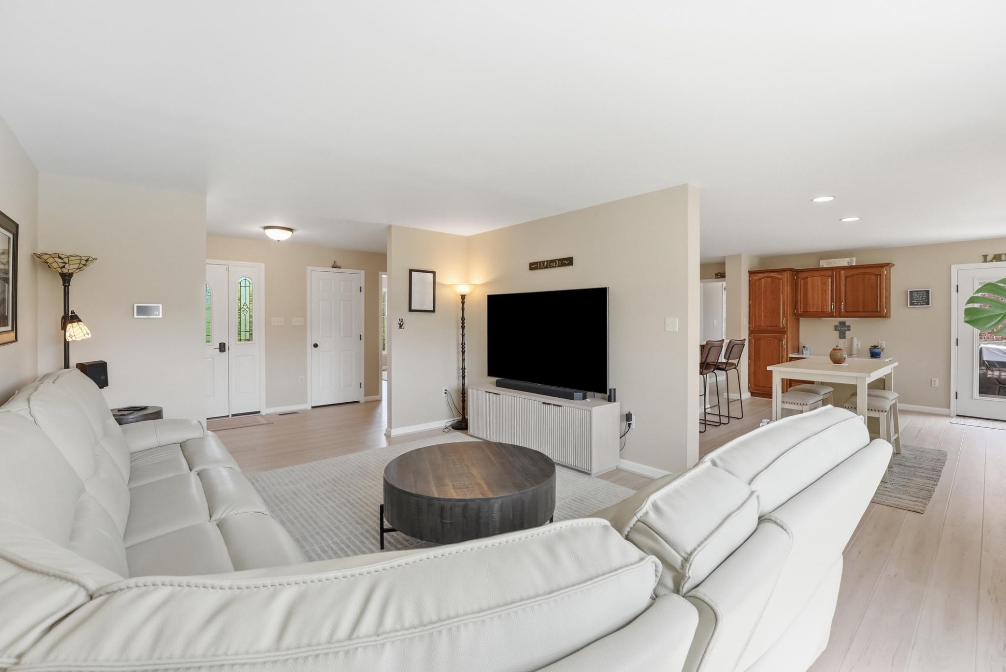 11337 Old Stillhouse Road Boston, VA 22713 - Photo 16 of 58 a living room with furniture and a flat screen tv