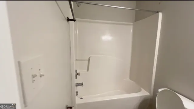 a close up of a bathtub in a bathroom