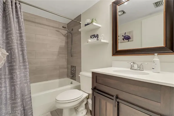a bathroom with a sink a toilet and a bathtub