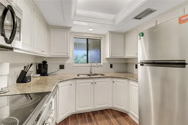 a kitchen with a sink and cabinets