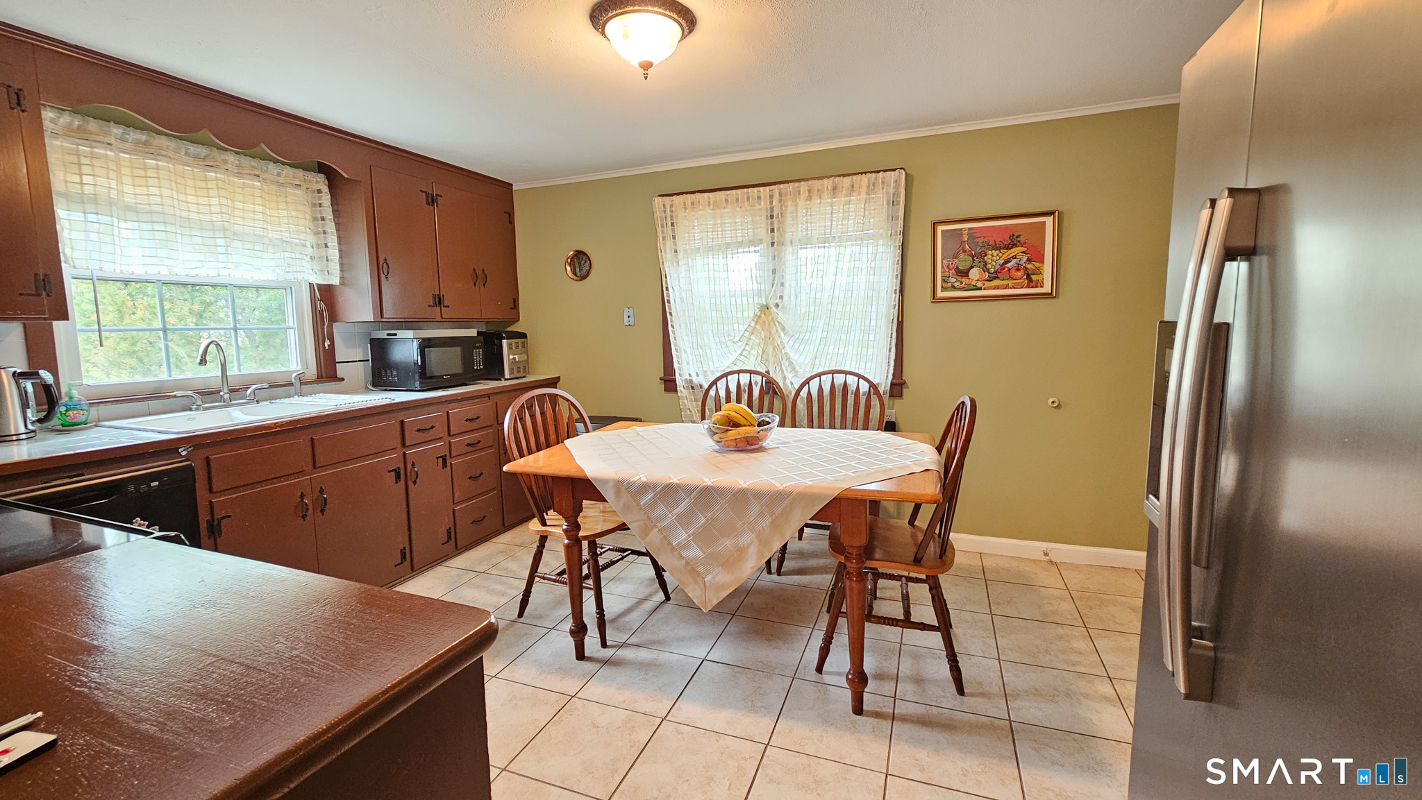 384 Long Hill Road South Windsor, CT 06074 - Photo 16 of 40 a view of a dining room with furniture and a window