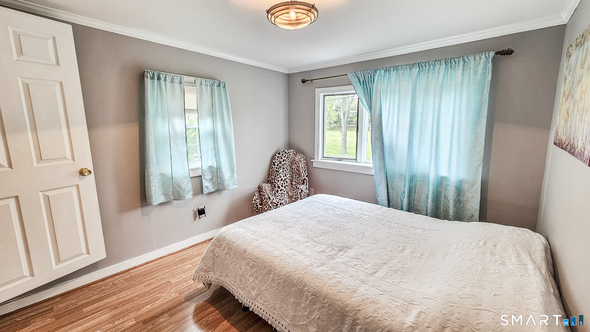 384 Long Hill Road South Windsor, CT 06074 - Photo 21 of 40 a bedroom with a bed and a window with wooden floor