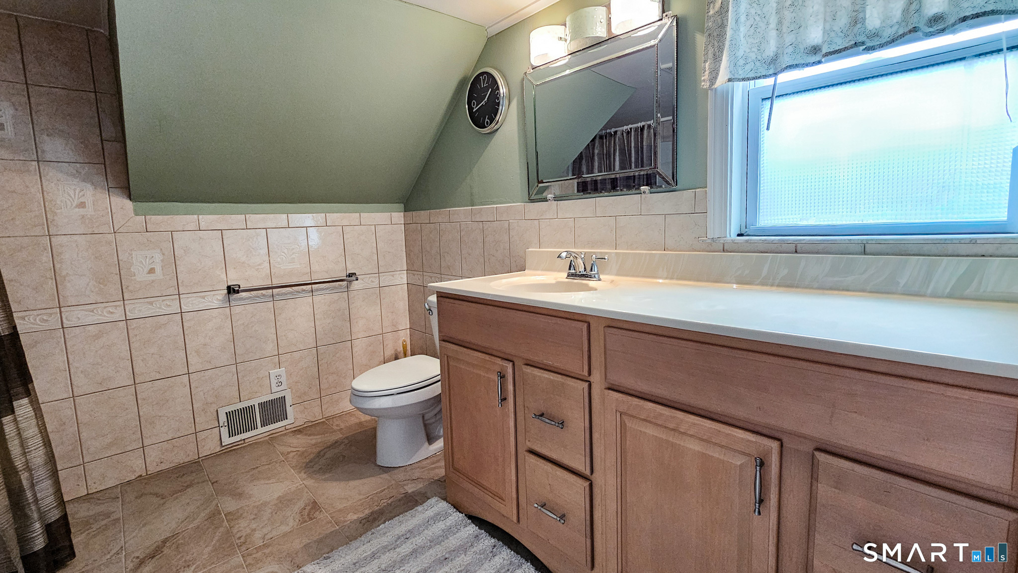 384 Long Hill Road South Windsor, CT 06074 - Photo 24 of 40 a bathroom with a toilet sink and mirror