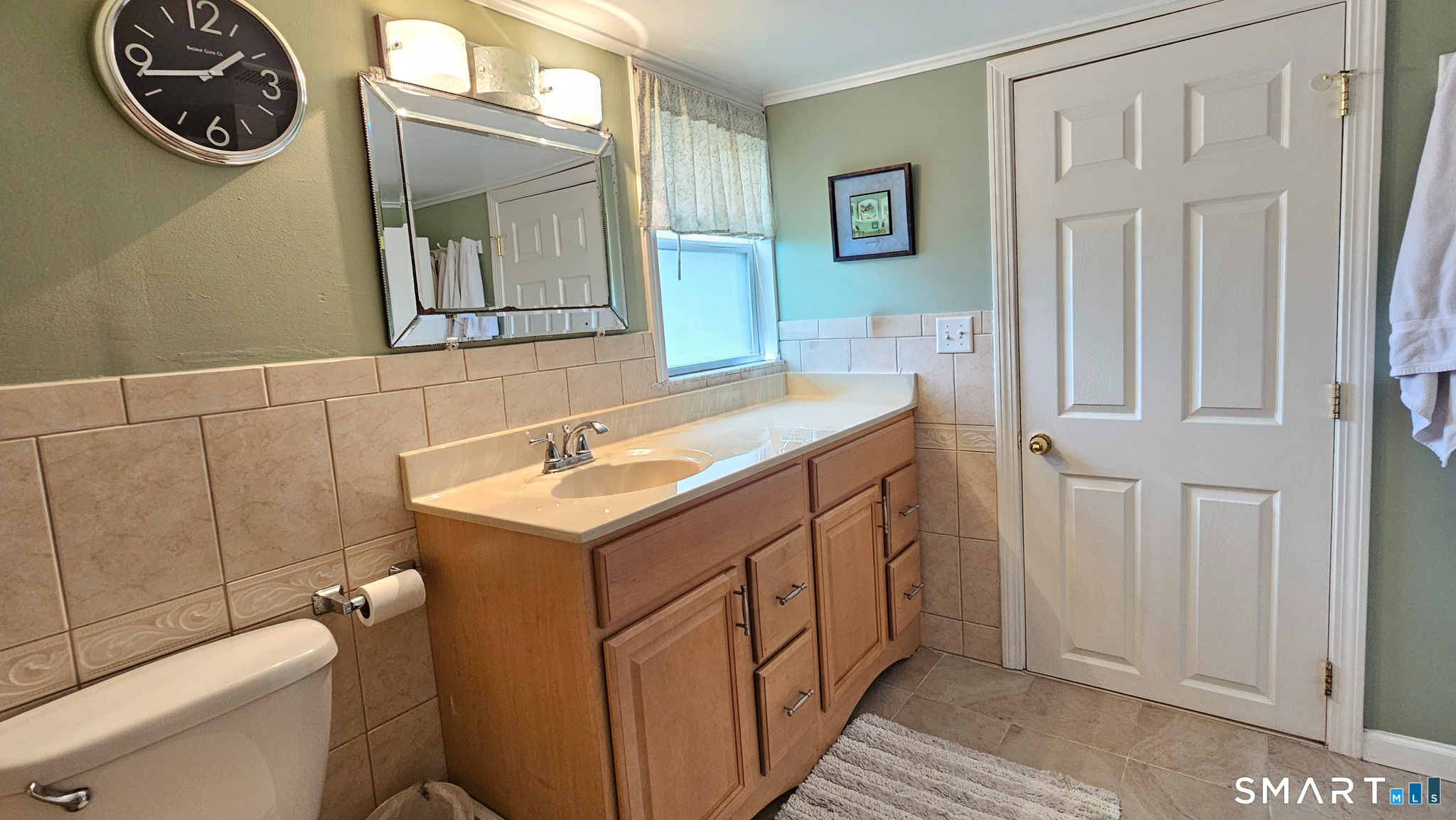 384 Long Hill Road South Windsor, CT 06074 - Photo 25 of 40 a bathroom with a sink a toilet and a mirror