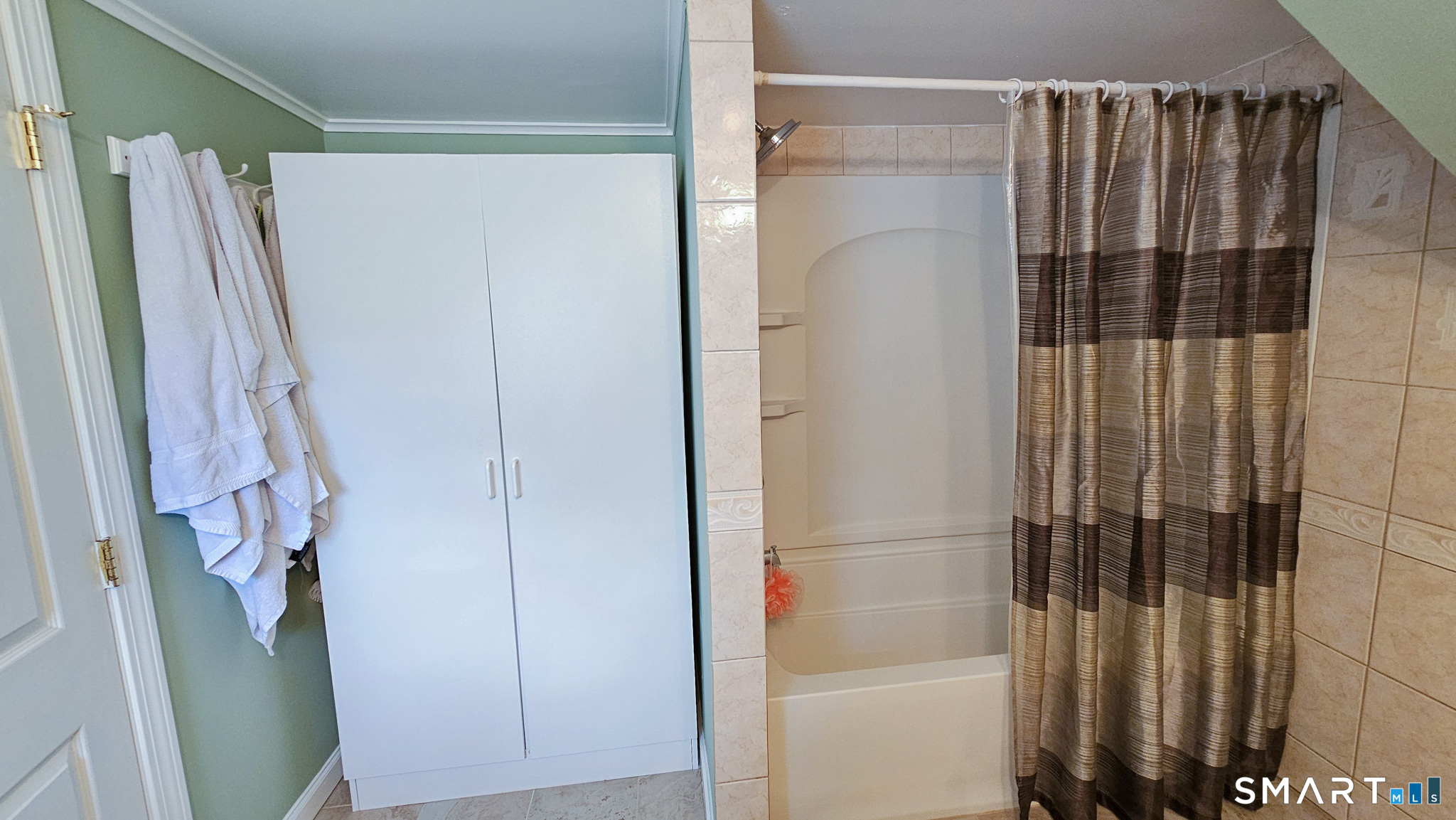 384 Long Hill Road South Windsor, CT 06074 - Photo 26 of 40 a bathroom with a shower and a tub