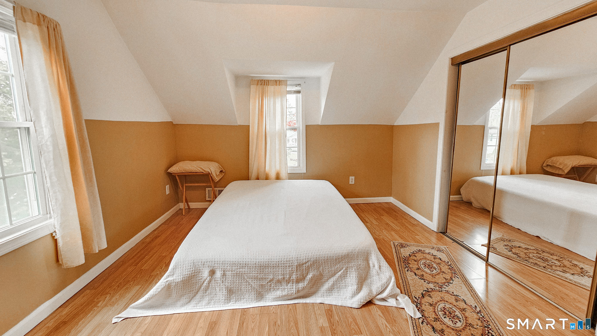 384 Long Hill Road South Windsor, CT 06074 - Photo 27 of 40 a spacious bedroom with a bed and wooden floor