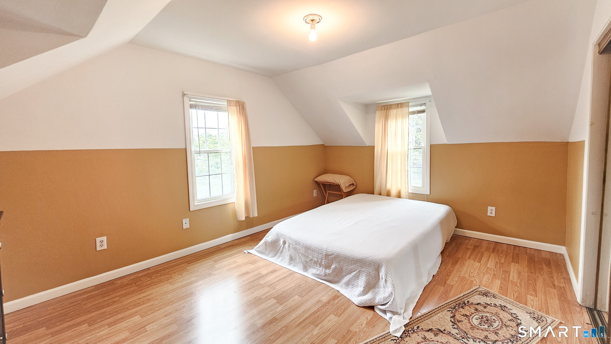 384 Long Hill Road South Windsor, CT 06074 - Photo 28 of 40 a bedroom with a bed and wooden floor