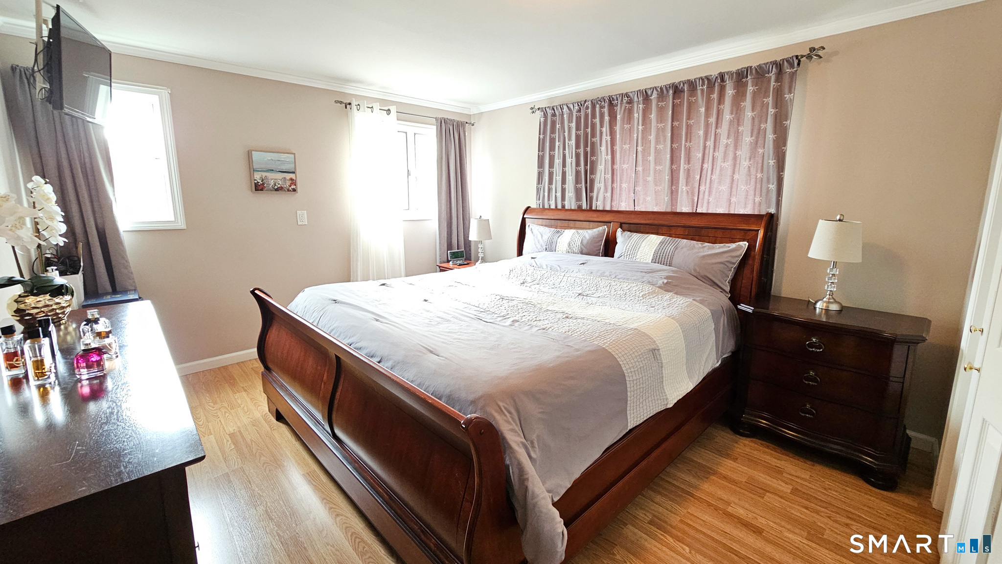 384 Long Hill Road South Windsor, CT 06074 - Photo 30 of 40 a bedroom with a bed and wooden floor
