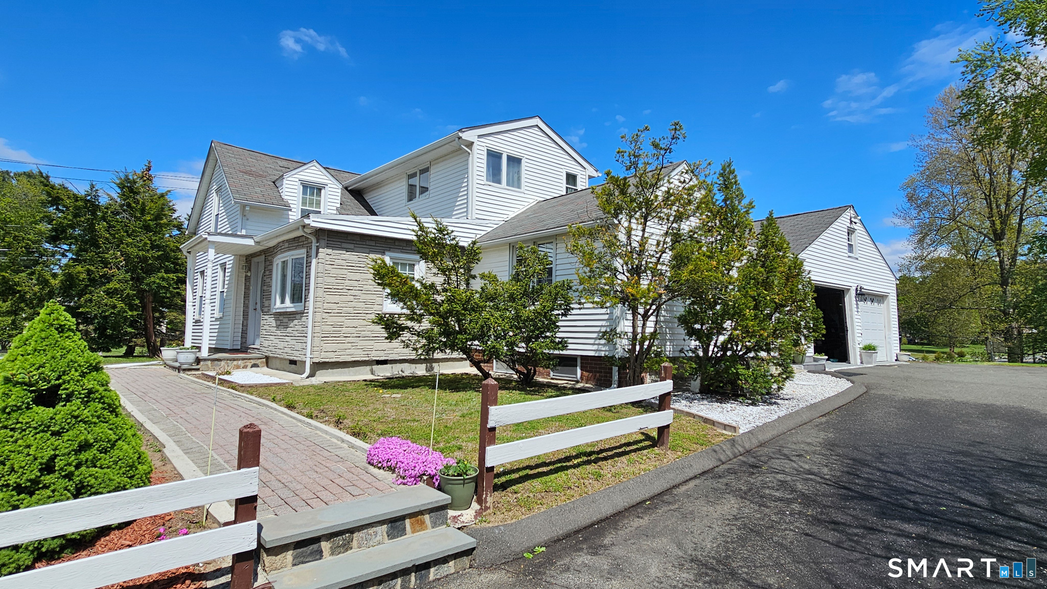 384 Long Hill Road South Windsor, CT 06074 - Photo 3 of 40 a front view of house with yard and trees in the background