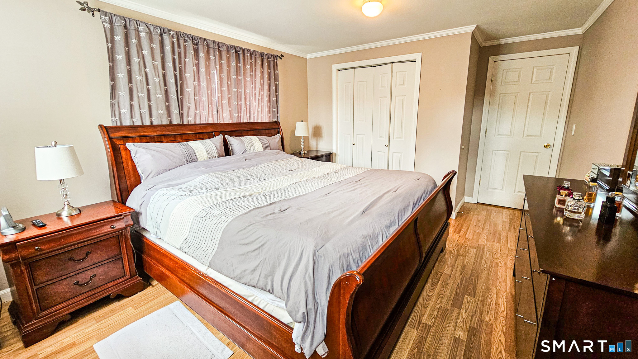384 Long Hill Road South Windsor, CT 06074 - Photo 31 of 40 a bedroom with a bed and wooden floor