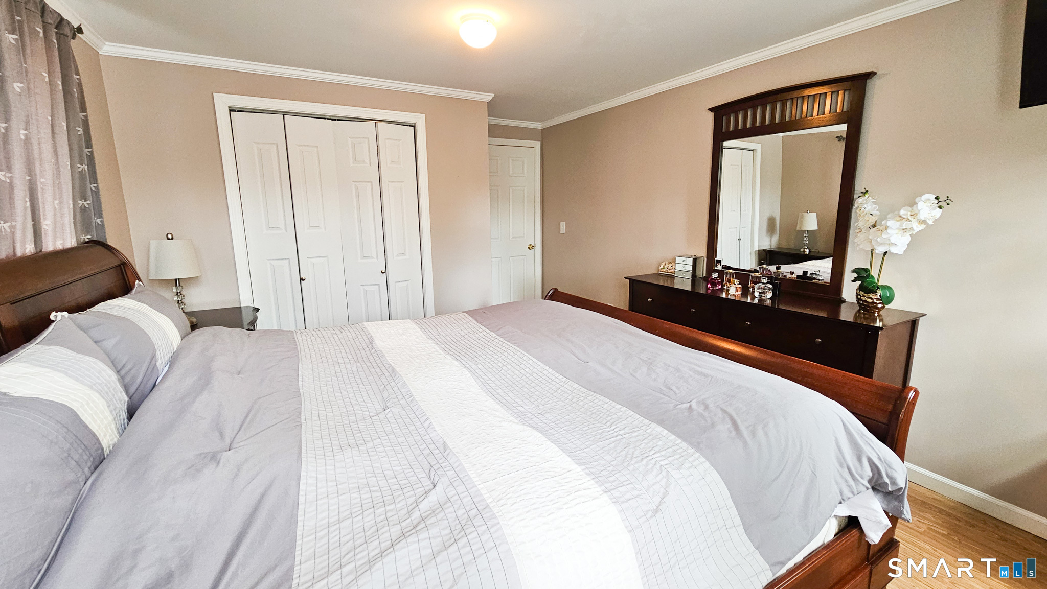 384 Long Hill Road South Windsor, CT 06074 - Photo 32 of 40 a bedroom with a bed and a mirror