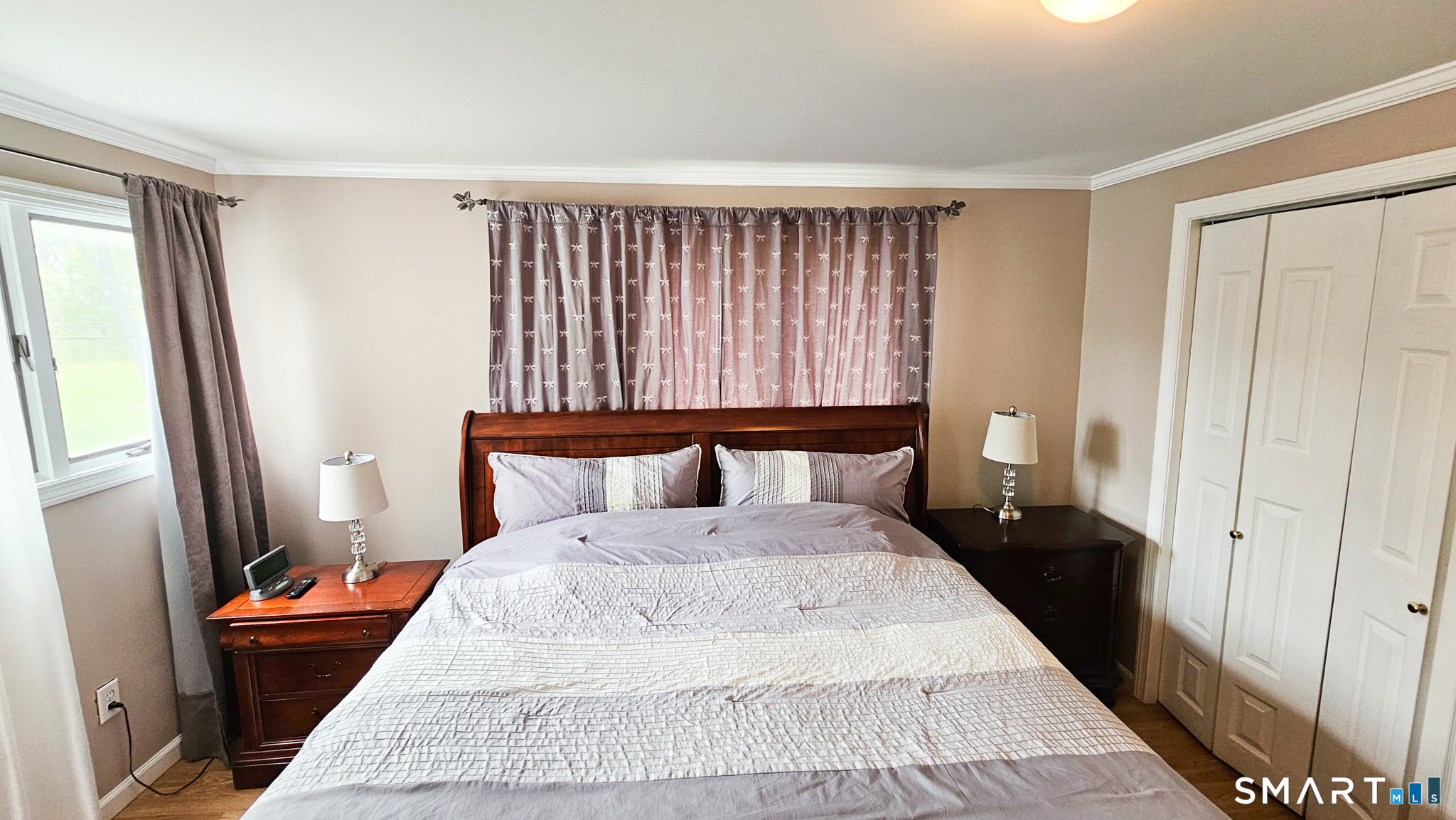 384 Long Hill Road South Windsor, CT 06074 - Photo 33 of 40 a large bed in a bedroom next to a window