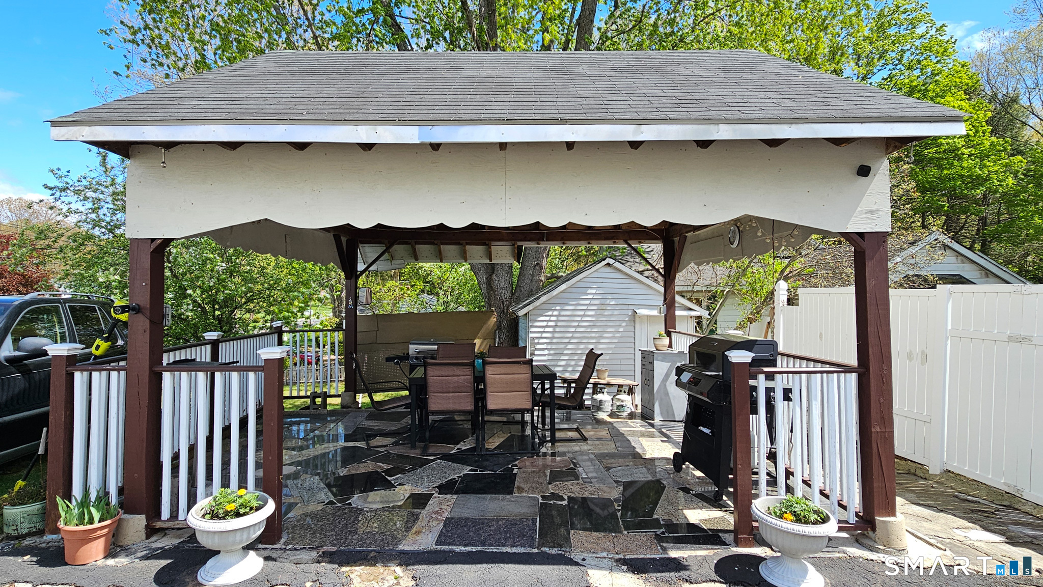384 Long Hill Road South Windsor, CT 06074 - Photo 36 of 40 a view of a patio with table and chairs and potted plants