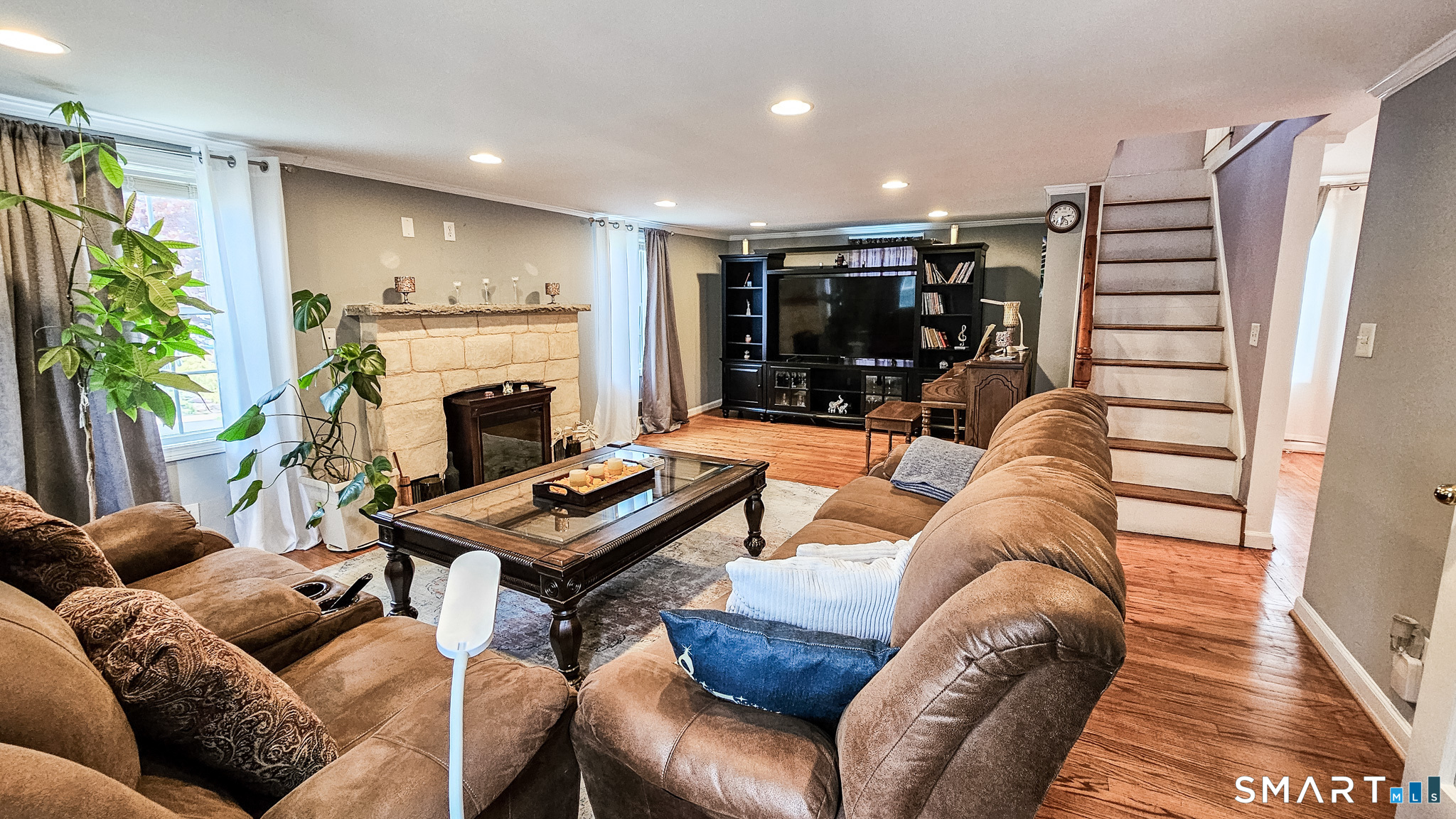 384 Long Hill Road South Windsor, CT 06074 - Photo 7 of 40 a living room with furniture and a fireplace