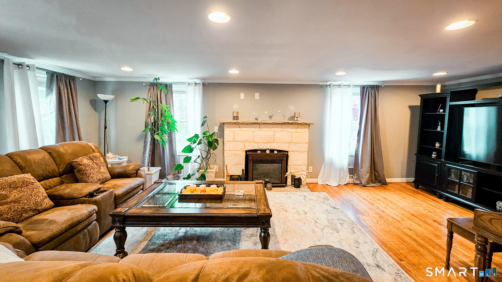 384 Long Hill Road South Windsor, CT 06074 - Photo 8 of 40 a living room with furniture and a flat screen tv