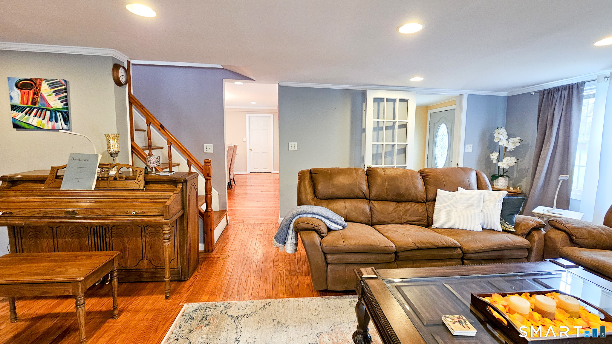 384 Long Hill Road South Windsor, CT 06074 - Photo 10 of 40 a living room with furniture and a flat screen tv