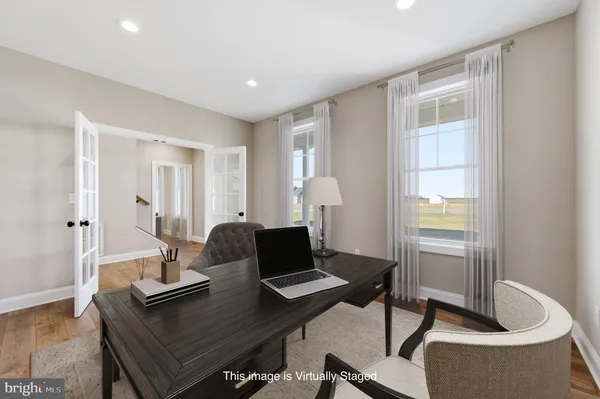 a workspace with furniture and window