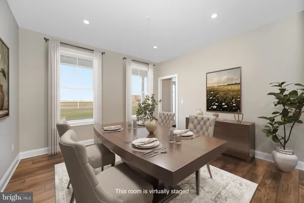 a view of a dining room with furniture and window