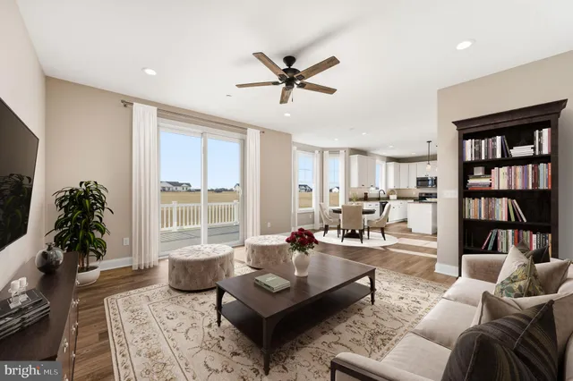 a living room with furniture or window and a bookshelf