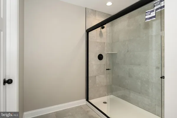 a bathroom with a shower and a bathtub