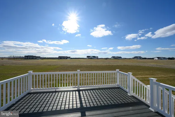 a view of a balcony with wooden floor & a terrace