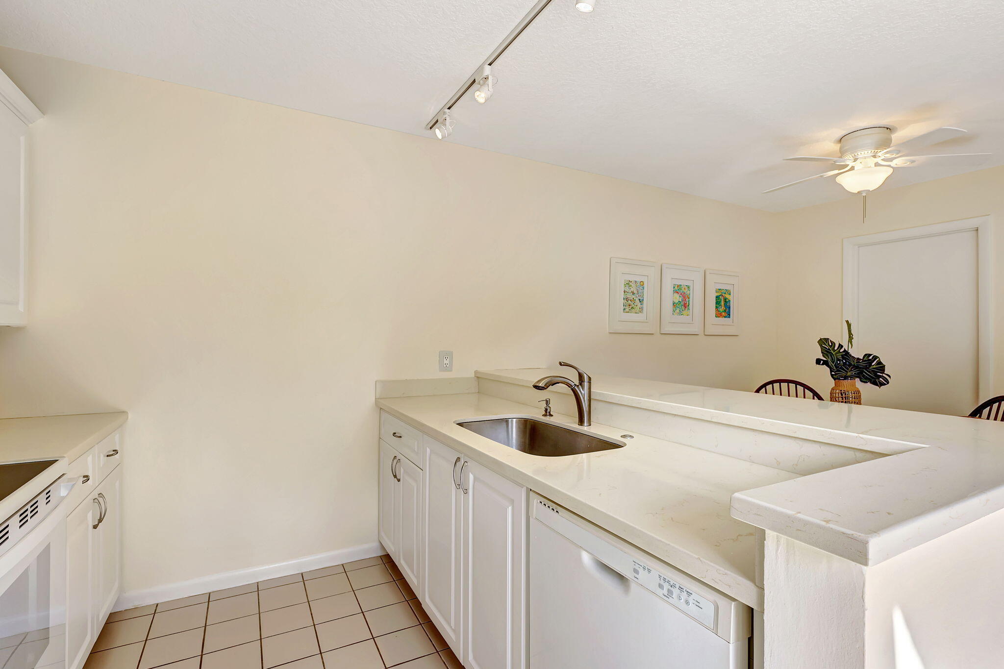 2332 23rd Court, Unit 57D Jupiter, FL 33477 - Photo 17 of 53 a bathroom with a sink and a mirror
