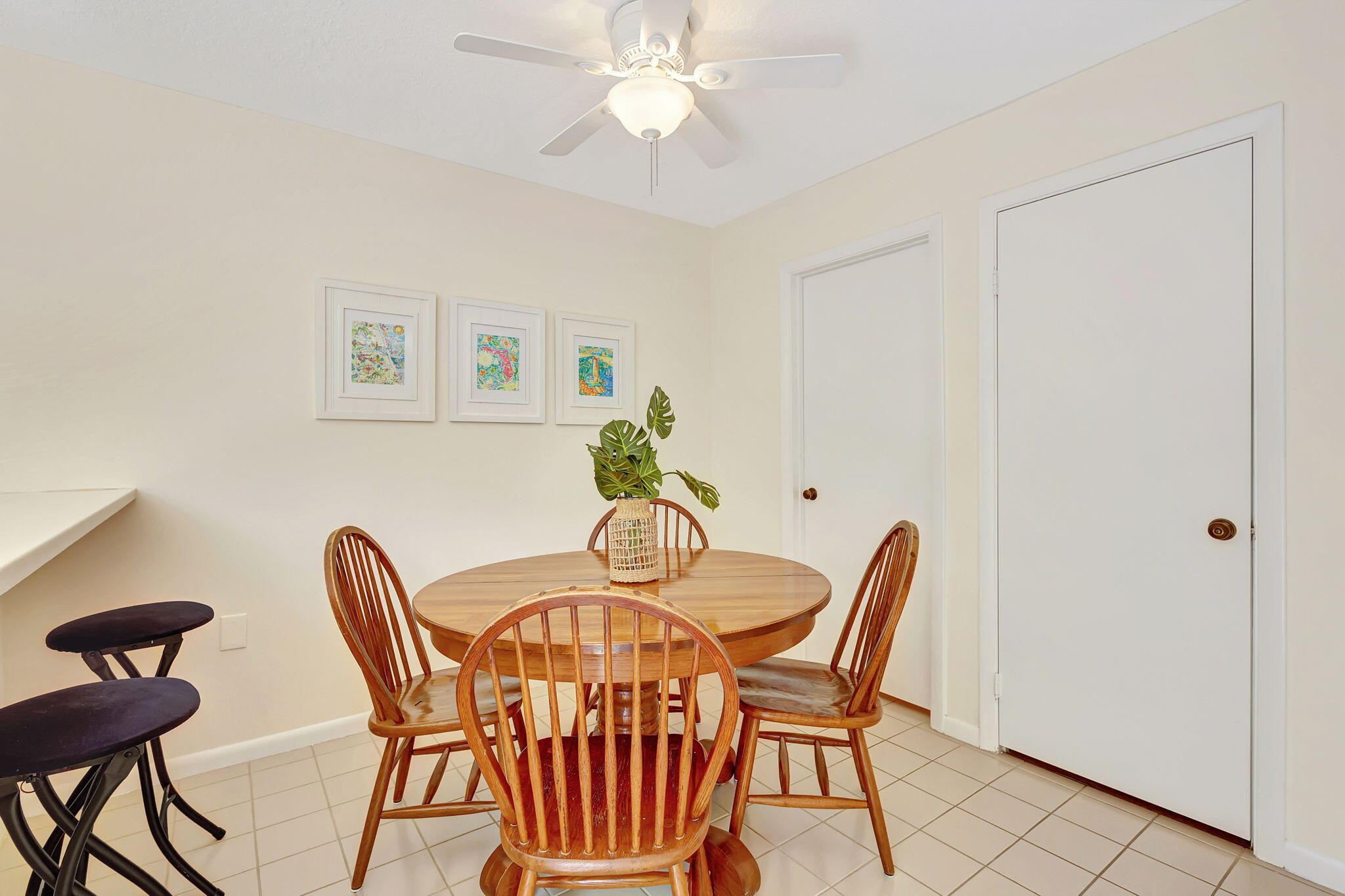 2332 23rd Court, Unit 57D Jupiter, FL 33477 - Photo 18 of 53 a view of a dining room with furniture and chandelier fan