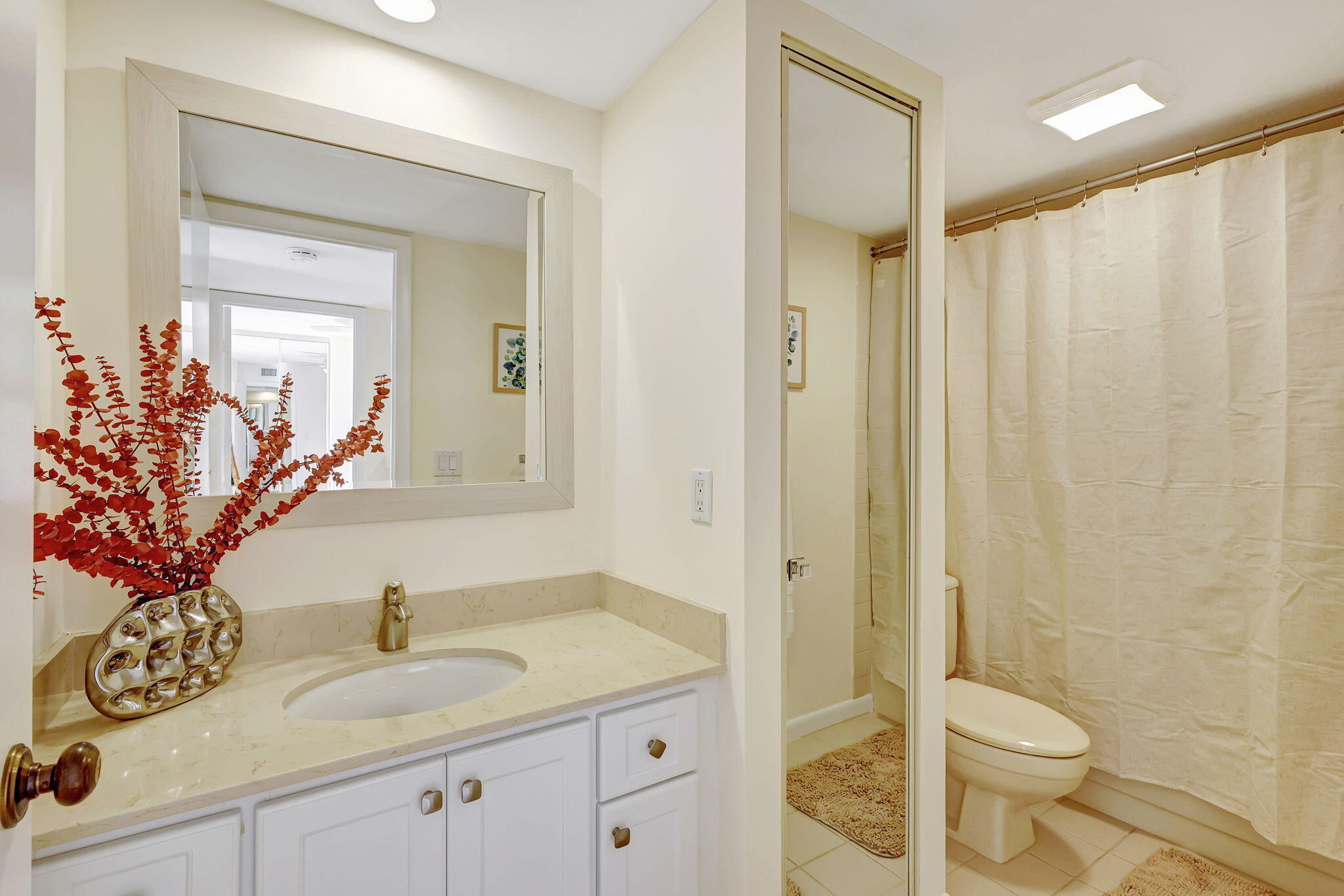 2332 23rd Court, Unit 57D Jupiter, FL 33477 - Photo 29 of 53 a bathroom with a granite countertop sink toilet and shower