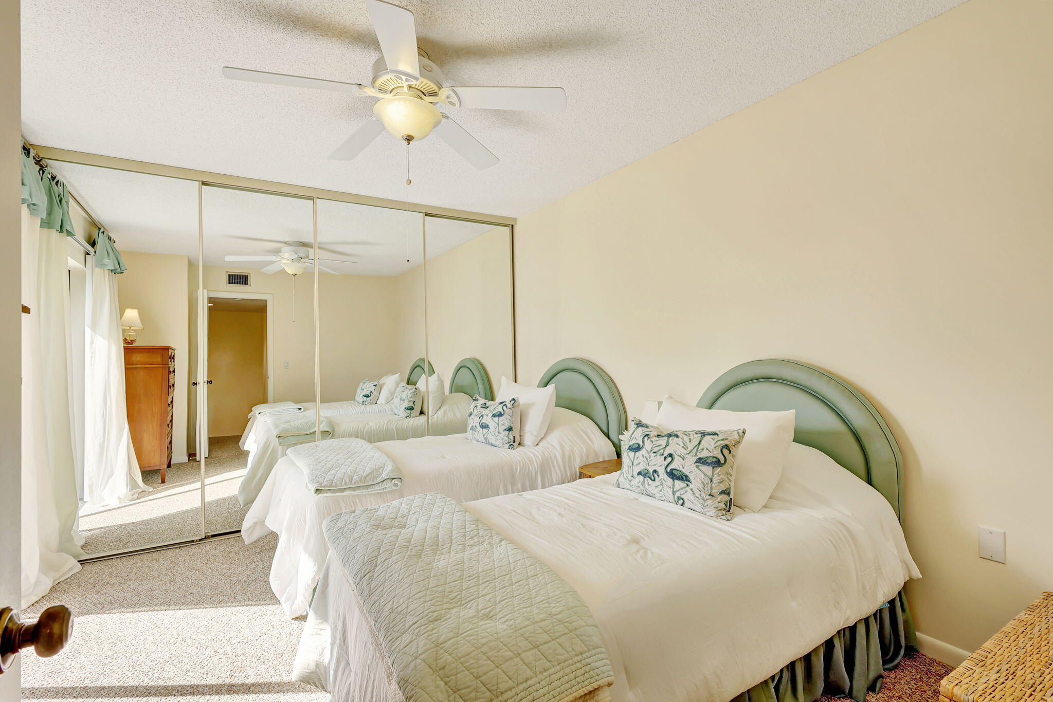2332 23rd Court, Unit 57D Jupiter, FL 33477 - Photo 30 of 53 a bedroom with bed and a chandelier