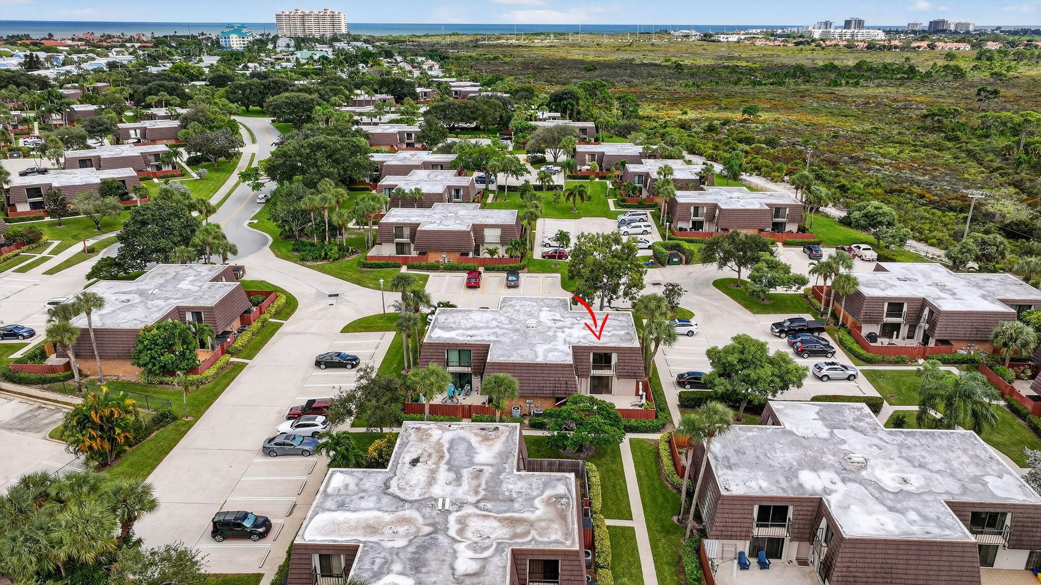 2332 23rd Court, Unit 57D Jupiter, FL 33477 - Photo 36 of 53 an aerial view of residential houses with outdoor space
