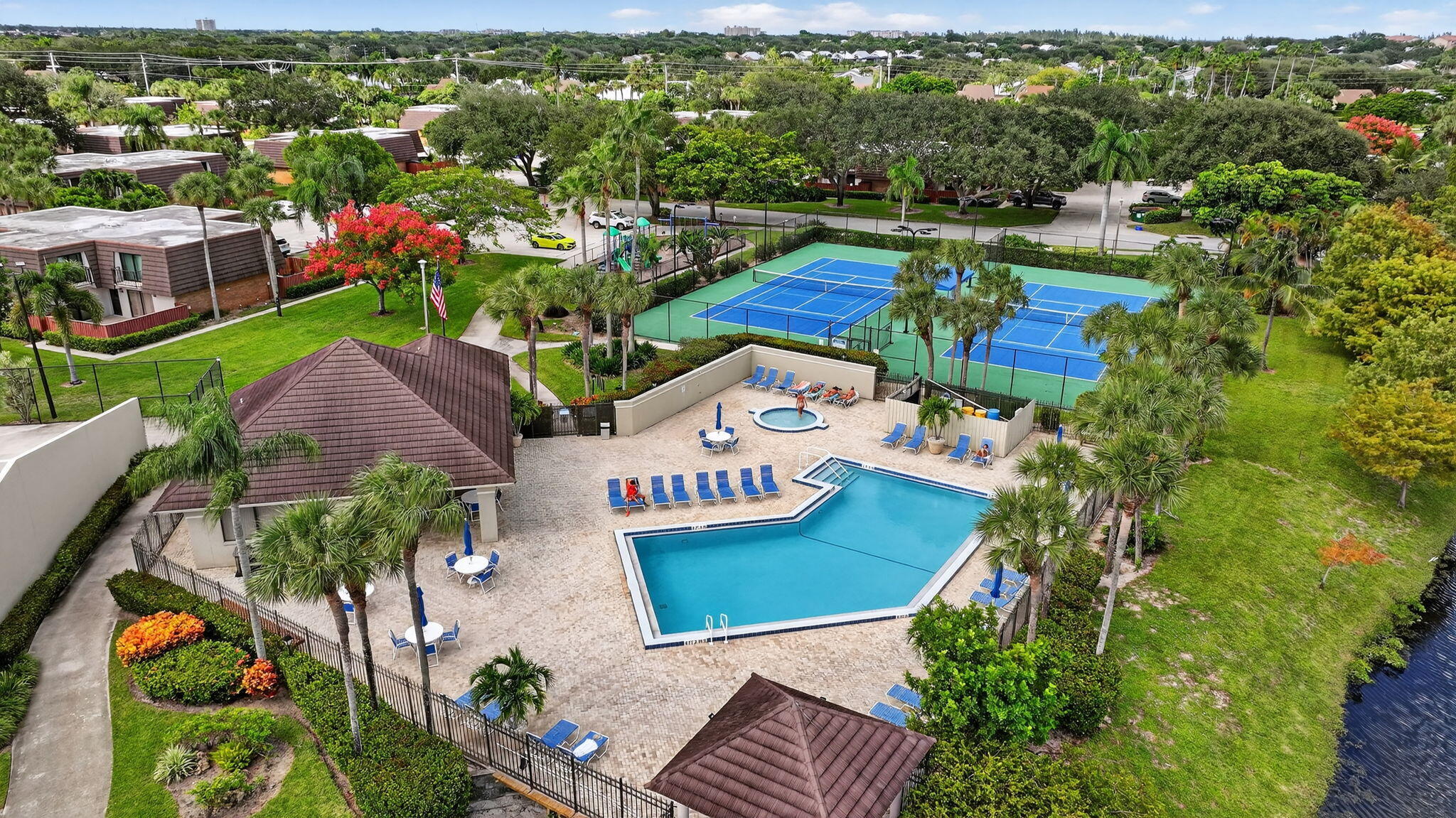 2332 23rd Court, Unit 57D Jupiter, FL 33477 - Photo 40 of 53 an aerial view of a house with a garden and lake view