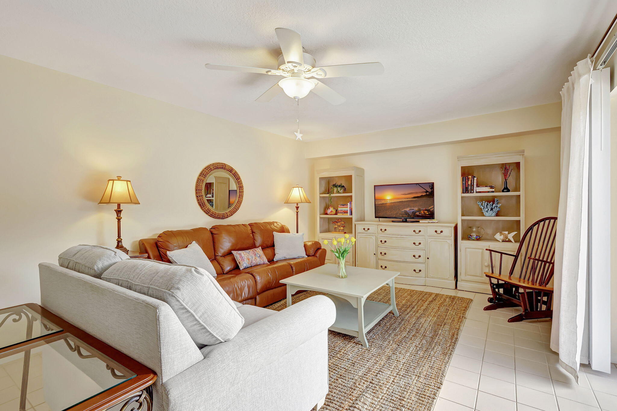 2332 23rd Court, Unit 57D Jupiter, FL 33477 - Photo 7 of 53 a living room with furniture and a window