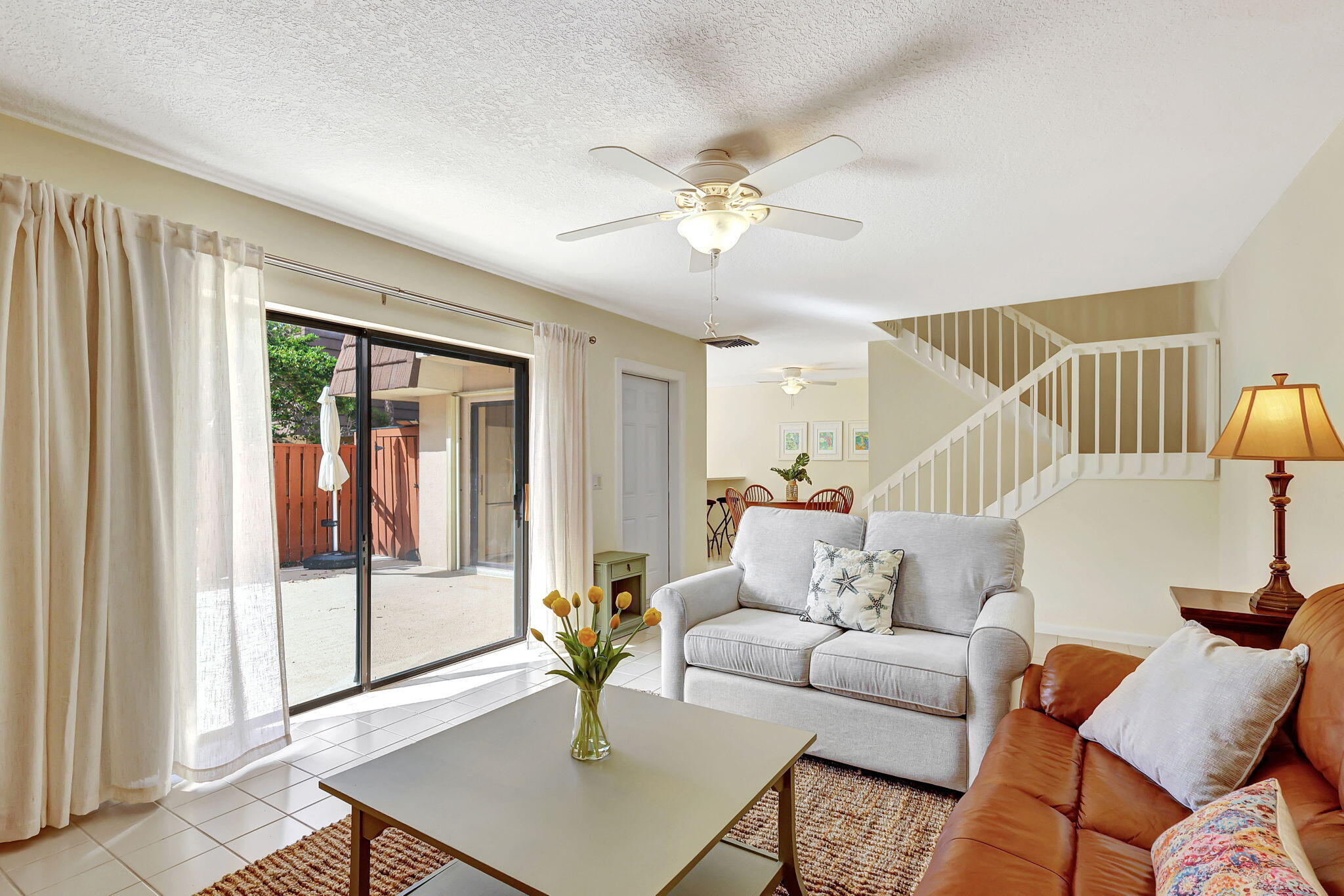 2332 23rd Court, Unit 57D Jupiter, FL 33477 - Photo 8 of 53 a living room with furniture and a window