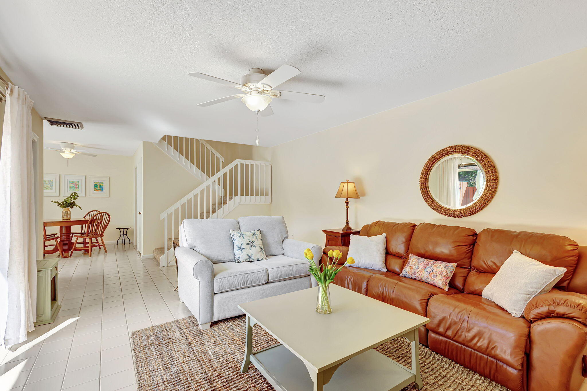 2332 23rd Court, Unit 57D Jupiter, FL 33477 - Photo 9 of 53 a living room with furniture a rug and a window