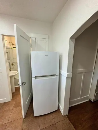 a white refrigerator freezer and a dishwasher in a kitchen