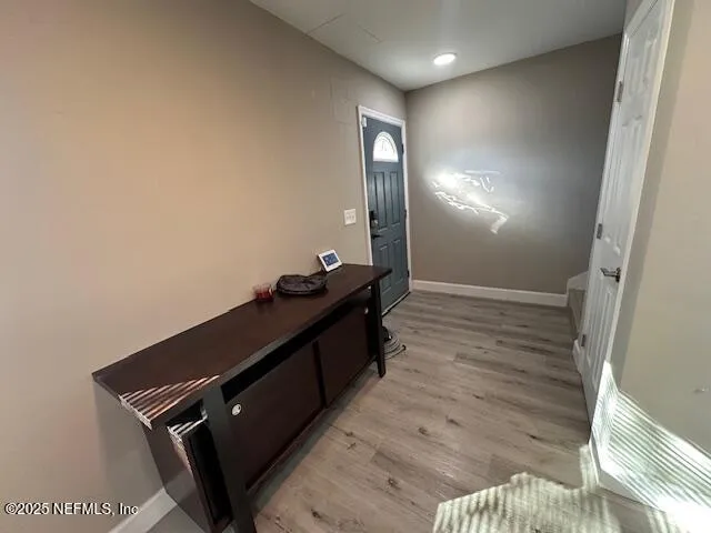 a view of room with wooden floor