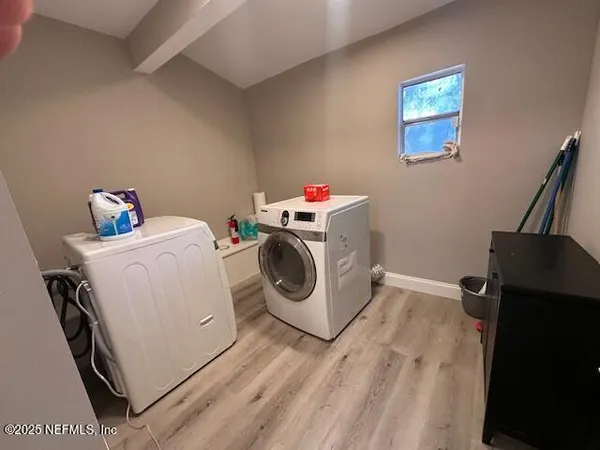 a utility room with dryer and washer