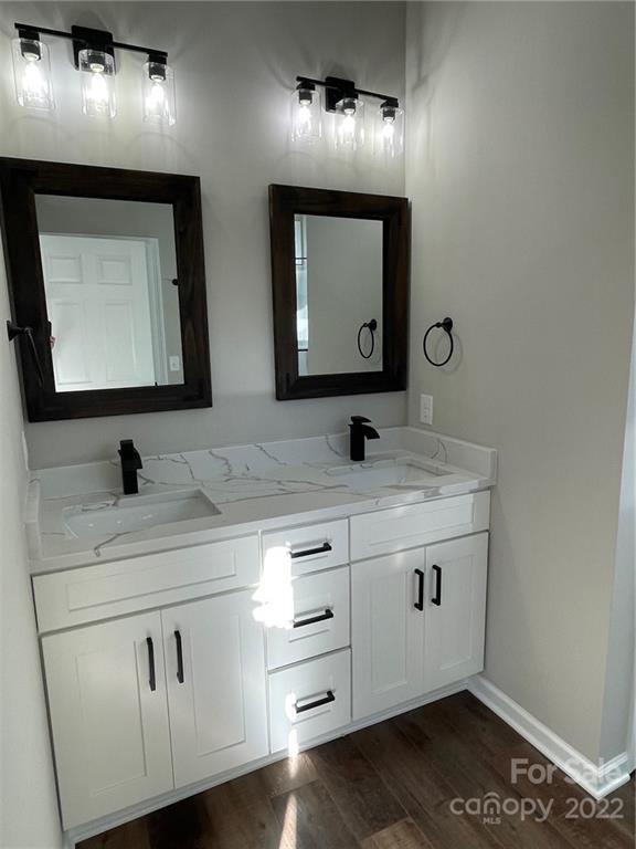 152 Eagles Landing Morganton, NC 28655 - Photo 13 of 27 a bathroom with double sink and a mirror