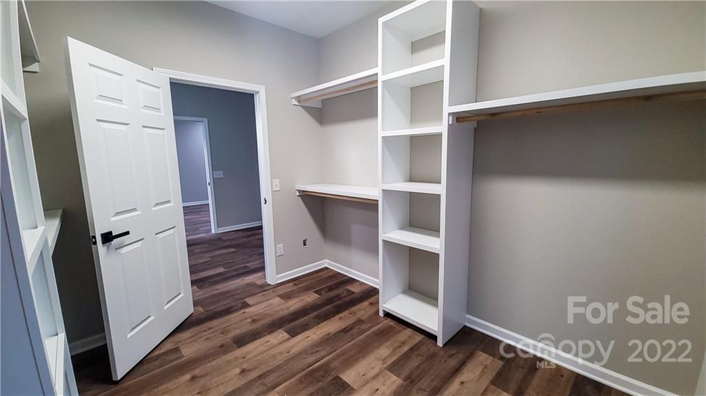 152 Eagles Landing Morganton, NC 28655 - Photo 15 of 27 a view of walk in closet with empty racks
