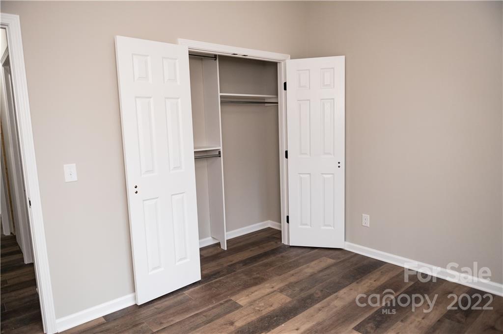 152 Eagles Landing Morganton, NC 28655 - Photo 19 of 27 an empty room with wooden floor & closet area