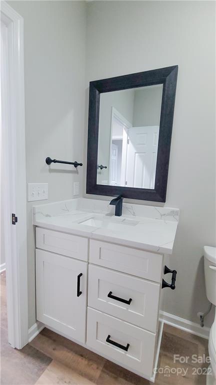 152 Eagles Landing Morganton, NC 28655 - Photo 21 of 27 a bathroom with a sink vanity and mirror